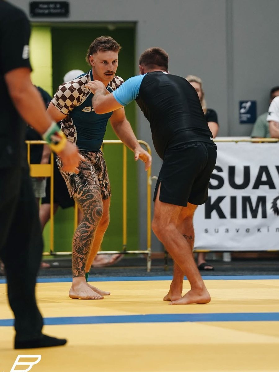 A Mentality Jiu Jitsu member hand-fighting in a No-Gi match at a BJJAO League event