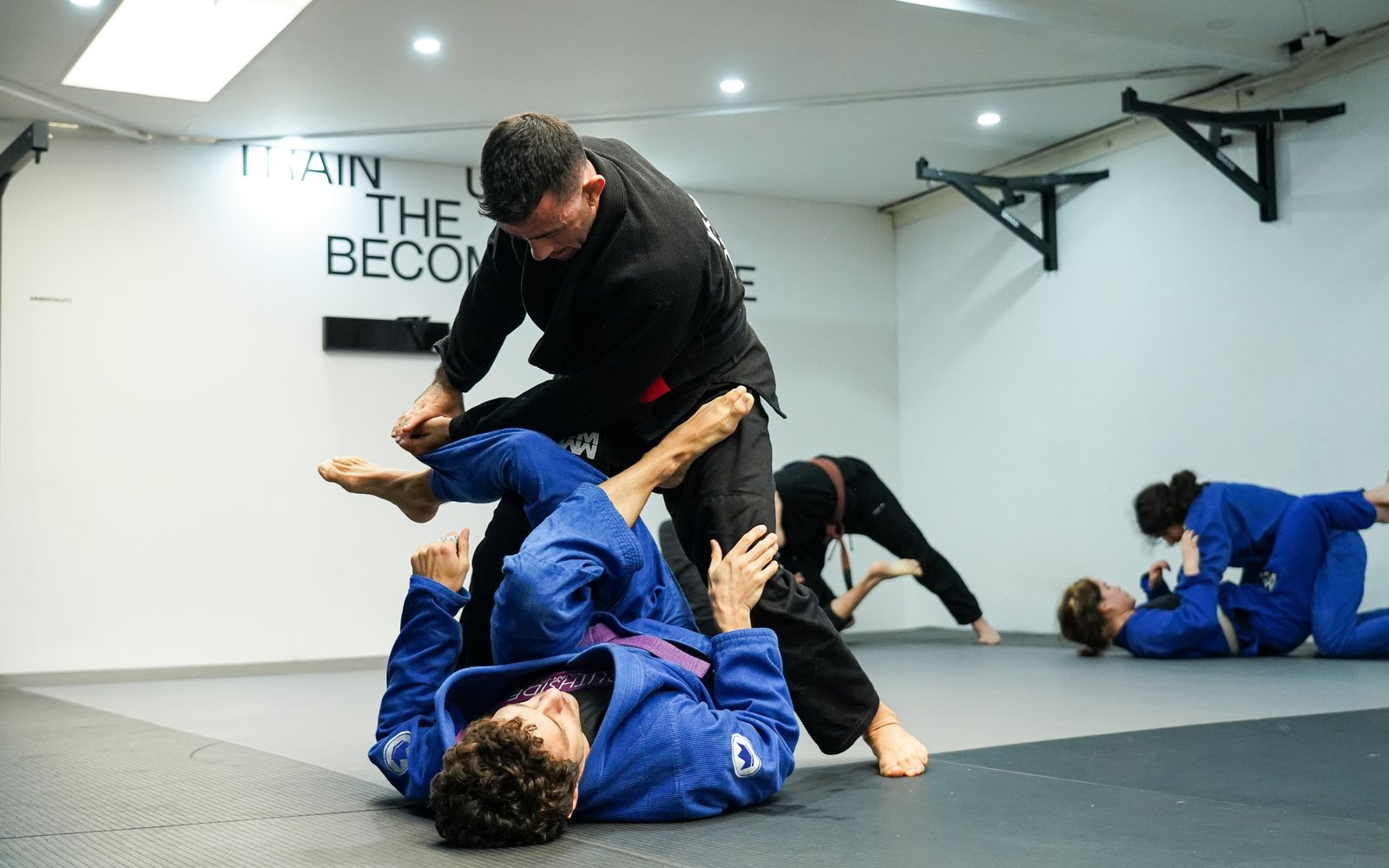 Two members working guard during Gi training